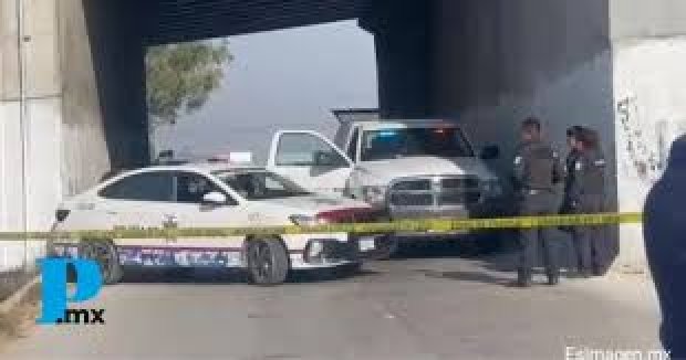 Hallan cuerpo embolsado bajo puente de Xonacatepec